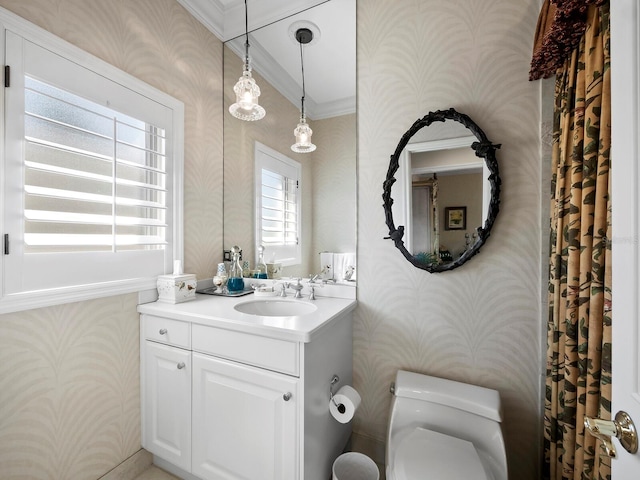 bathroom featuring toilet, wallpapered walls, vanity, and ornamental molding