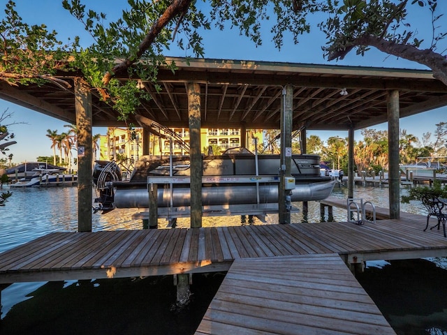 view of dock with a water view and boat lift