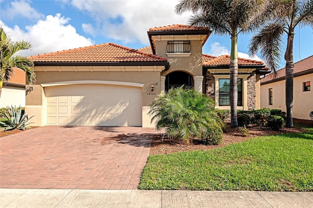 mediterranean / spanish-style home featuring a garage