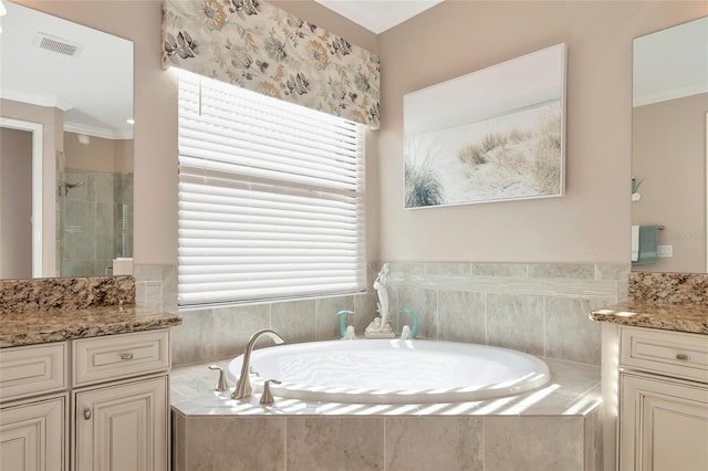 bathroom featuring vanity, crown molding, and shower with separate bathtub