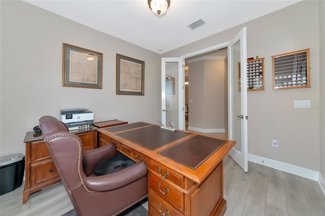 office space with light wood-type flooring