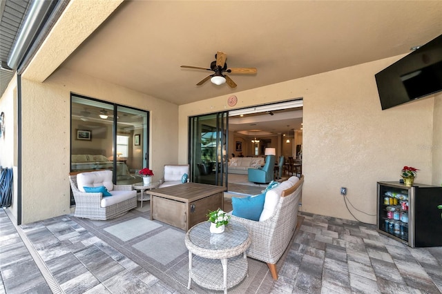 view of patio with ceiling fan and an outdoor hangout area