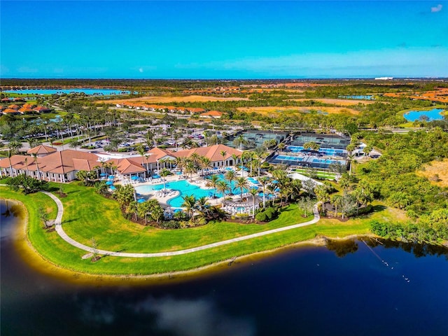 birds eye view of property with a water view