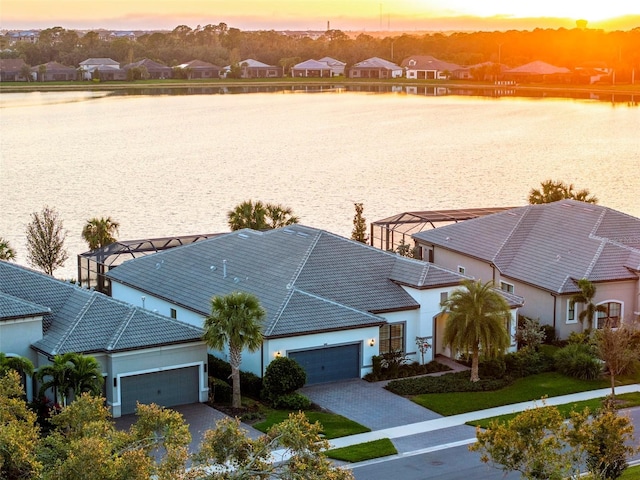 aerial view at dusk with a water view