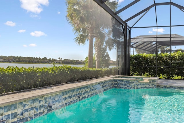 view of pool with an in ground hot tub, pool water feature, a water view, and glass enclosure