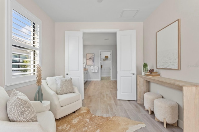 sitting room with light hardwood / wood-style floors