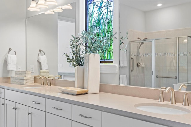 bathroom with vanity and an enclosed shower