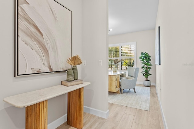 hall with light hardwood / wood-style floors