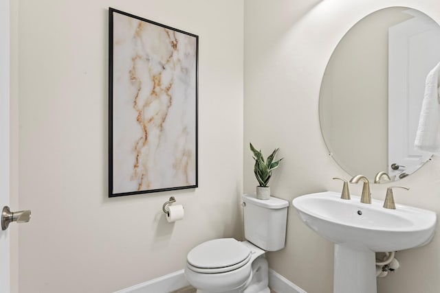 bathroom featuring sink and toilet