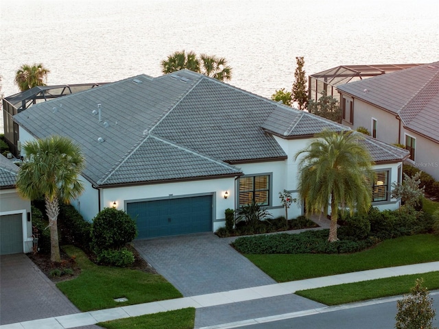 view of front facade with a front yard and a garage