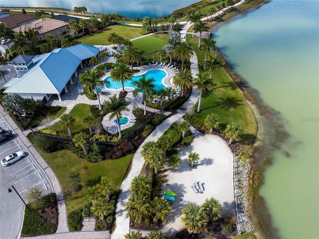 birds eye view of property with a water view