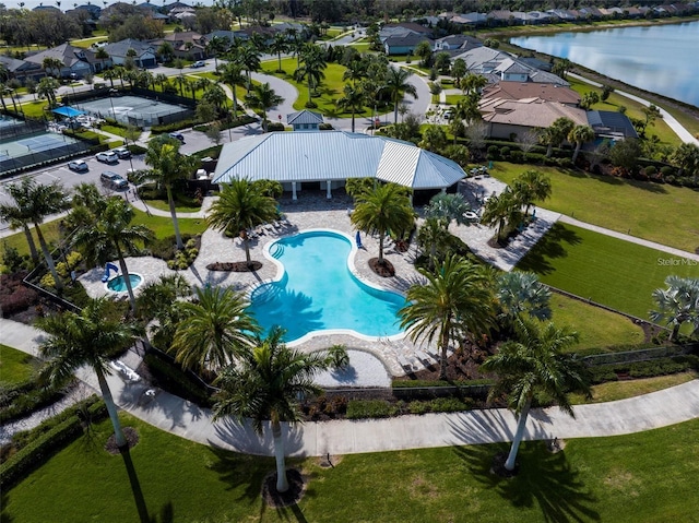 birds eye view of property featuring a water view