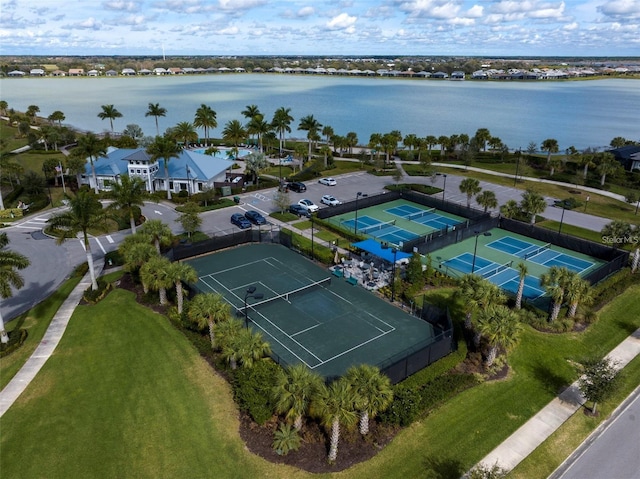 birds eye view of property with a water view