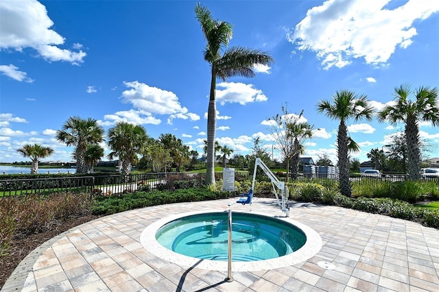 view of pool featuring a community hot tub and a patio