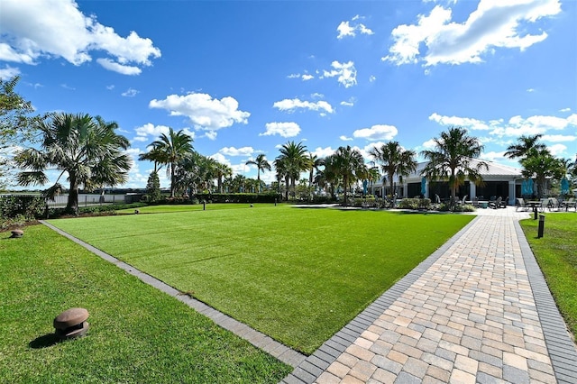 view of property's community with a lawn