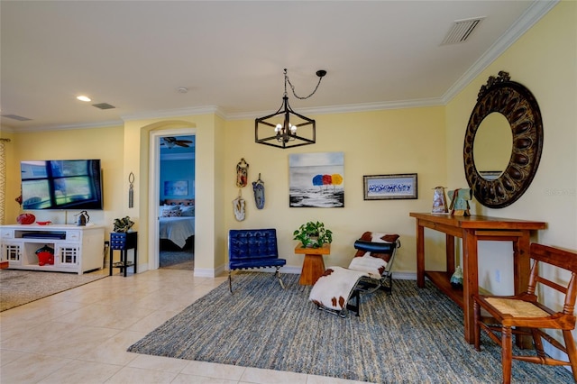 sitting room with ornamental molding, light tile patterned floors, and a chandelier