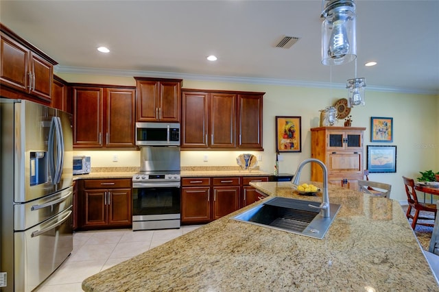 kitchen featuring sink, light stone counters, crown molding, light tile patterned floors, and appliances with stainless steel finishes