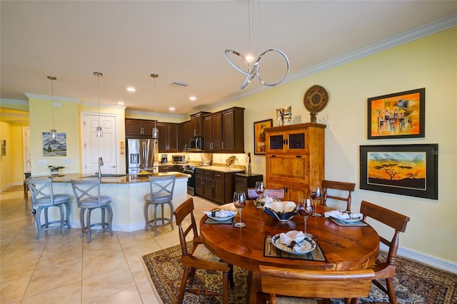 tiled dining area with sink, crown molding, and an inviting chandelier