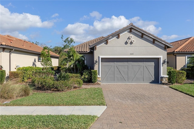 mediterranean / spanish house featuring a garage