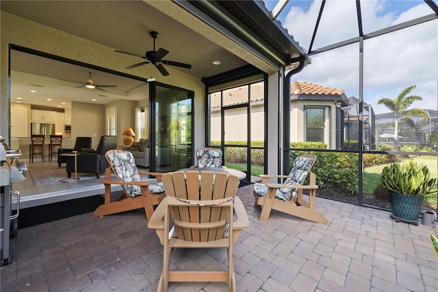 sunroom / solarium with ceiling fan