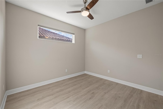 spare room with ceiling fan and light hardwood / wood-style floors