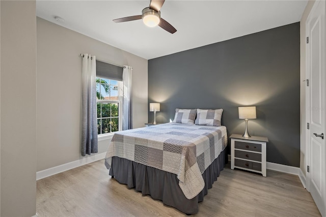 bedroom featuring ceiling fan and light hardwood / wood-style floors