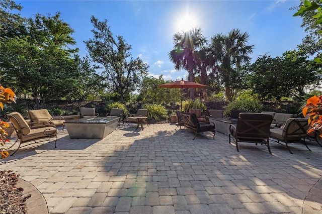 view of patio / terrace featuring an outdoor living space with a fire pit