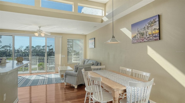 sunroom / solarium featuring ceiling fan