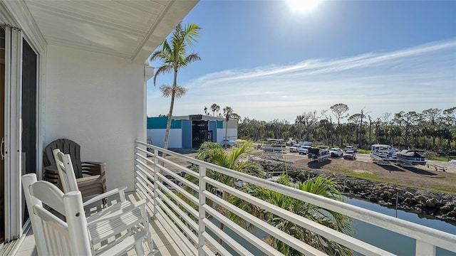 balcony featuring a water view