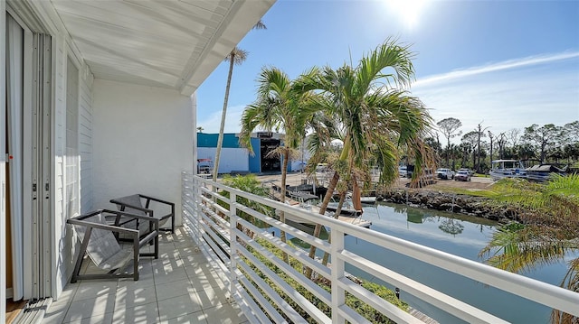 balcony featuring a water view