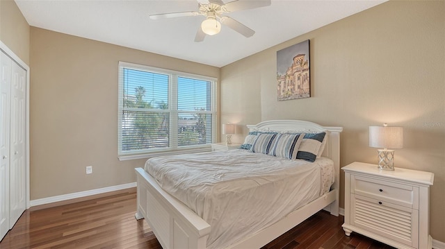 bedroom with dark hardwood / wood-style flooring, a closet, and ceiling fan