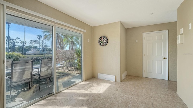 entryway with light tile patterned floors