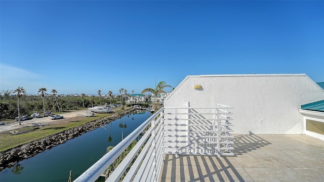 balcony featuring a water view