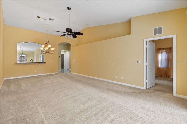 unfurnished living room with light carpet, ceiling fan with notable chandelier, lofted ceiling, and sink