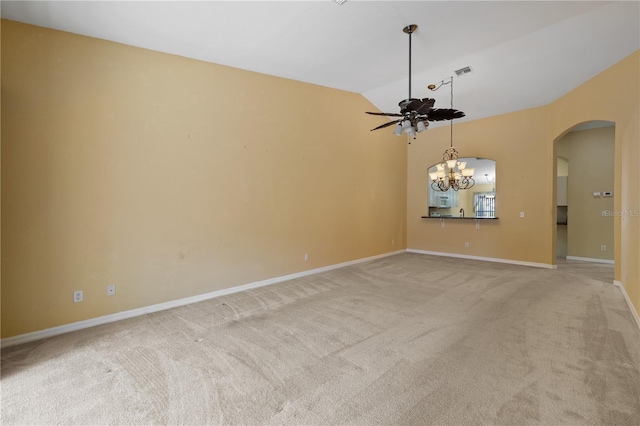 unfurnished room with light carpet, ceiling fan with notable chandelier, and lofted ceiling