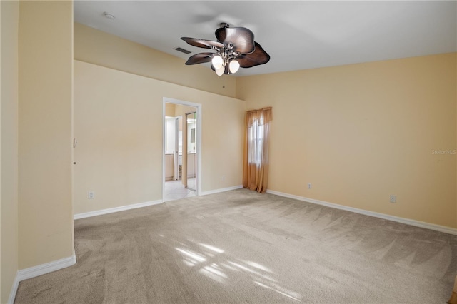 unfurnished room featuring light colored carpet and ceiling fan