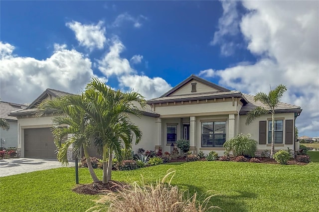 view of front of property featuring a garage and a front lawn