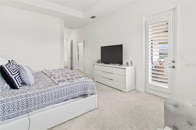 bedroom with light colored carpet