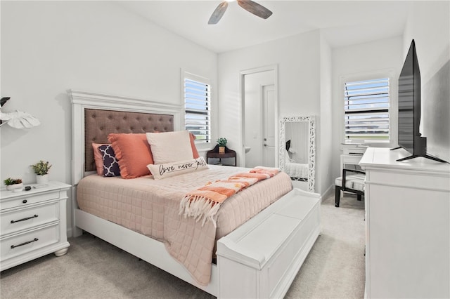 bedroom with light colored carpet and ceiling fan