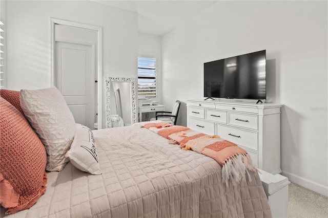 bedroom with light colored carpet