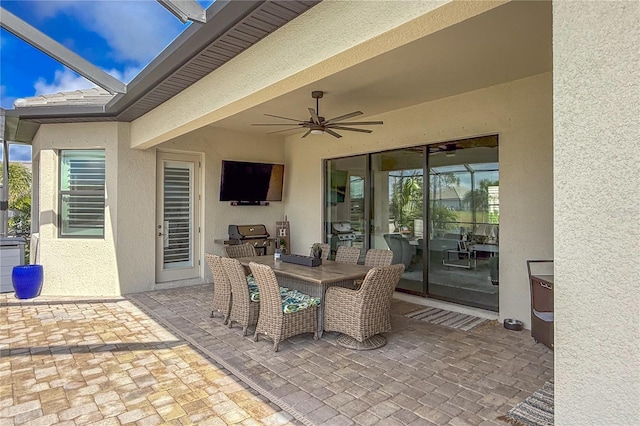 view of patio featuring ceiling fan