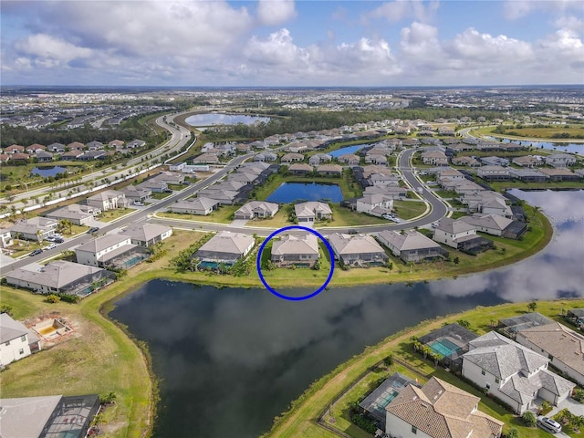 birds eye view of property featuring a water view