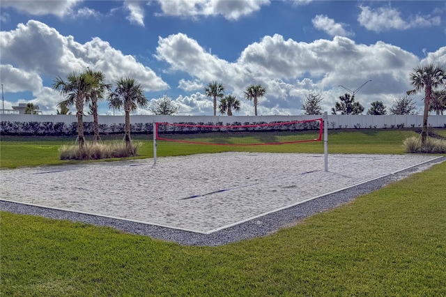 surrounding community with volleyball court and a yard