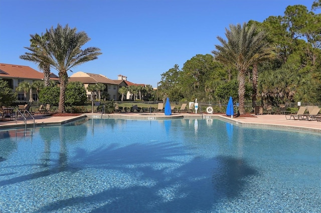 view of swimming pool featuring a patio area