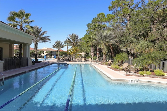 view of swimming pool with a patio