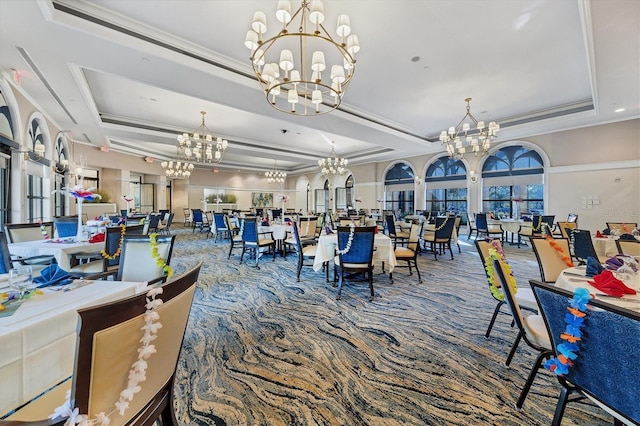 dining area featuring a wealth of natural light, ornamental molding, carpet, and a tray ceiling