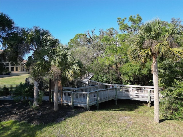 dock area featuring a deck and a yard