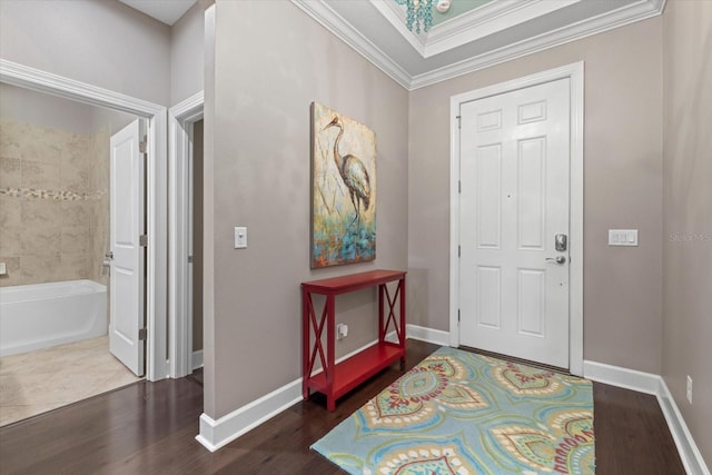 entryway featuring hardwood / wood-style flooring and crown molding