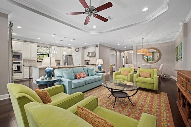 12606 Fontana Loop, Bradenton, FL 34211 - living area featuring dark wood finished floors, ceiling fan, recessed lighting, ornamental molding, and arched walkways