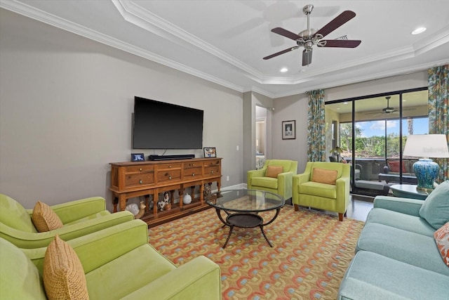 12606 Fontana Loop, Bradenton, FL 34211 - living room with a tray ceiling, ceiling fan, ornamental molding, and recessed lighting